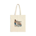 Beige tote bag with a graphic of a woman and text on a white background