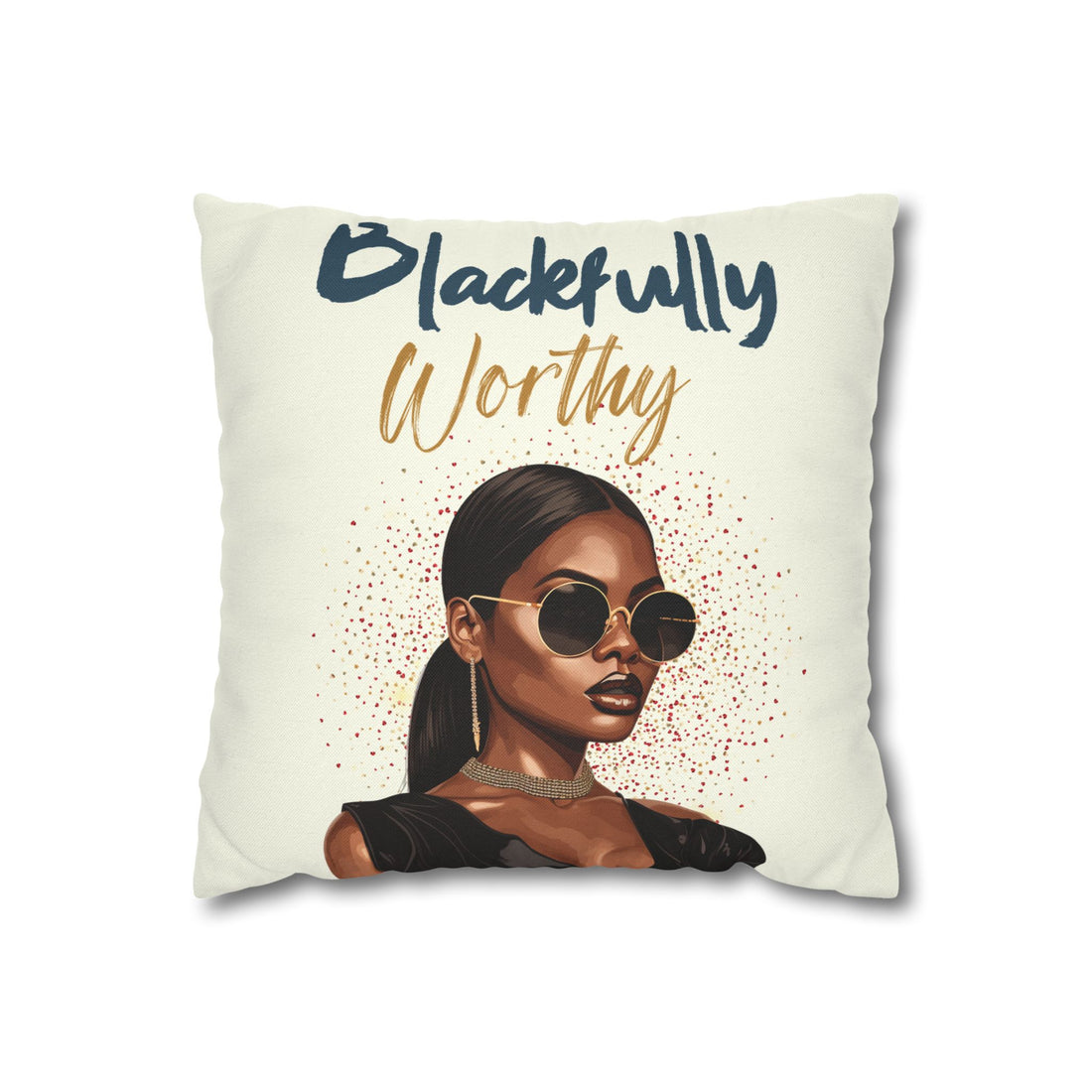 Pillow with a portrait of a woman wearing sunglasses and text 'Worthy' on a gray couch.