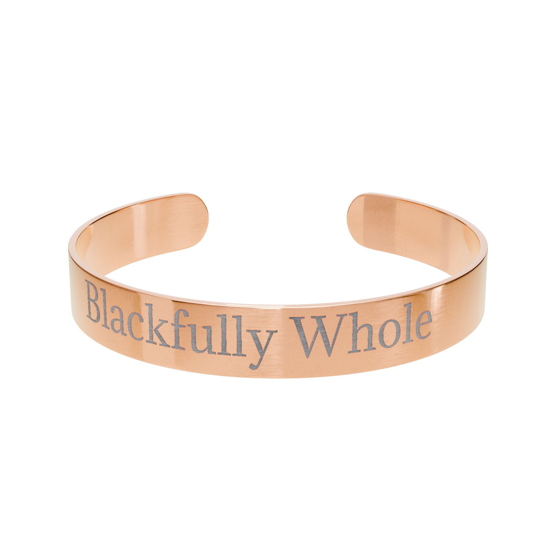 Rose gold bracelet with 'Blackfully Whole' engraving on a white background